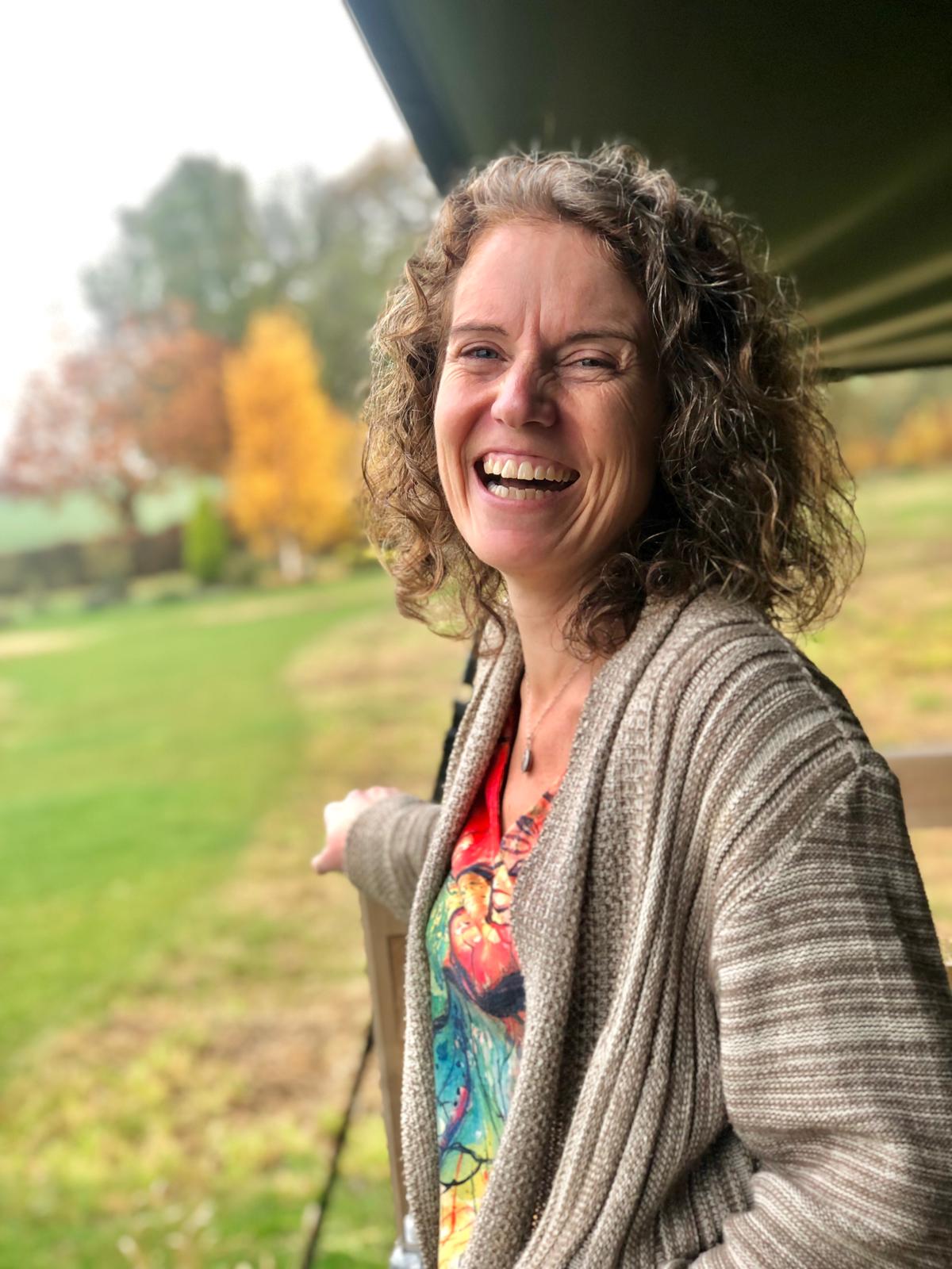 Gina Dallison laughing outdoors